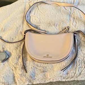 Leather crossbody bag, comes with dust cover. 10 inches across, 6 inches depth.